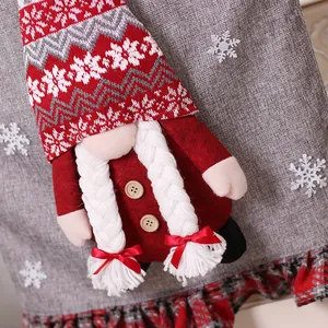Christmas gnome chair cover with red hat and white braids on grey snowflake fabric