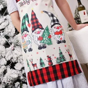 Christmas burlap apron with festive gnome print and red plaid hem for holiday kitchen decor