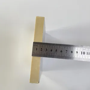 Macro view measuring 30mm thickness of the wooden Christmas gnome pendant with a steel ruler