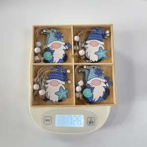 Weight display of 12-piece Christmas blue wooden gnome ornaments in a divided box