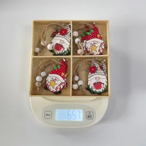 Detailed weight measurement showing 65.7g of wooden Christmas gnome hanging ornaments