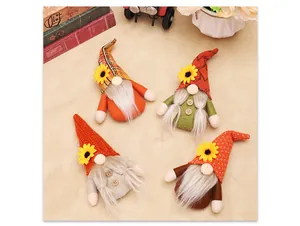 Set of four autumn harvest gnomes with sunflowers on a rustic tabletop background