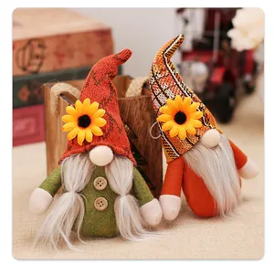 Detail of sunflower gnome plush ornaments featuring knitted hats and felt material