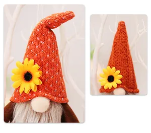 Detail of harvest gnome with orange knit hat, sunflower decor and long faux fur beard