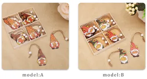 Detail of harvest gnome wooden ornaments with pumpkin and sunflower patterns in box
