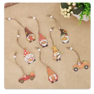 Detail of 8 autumn gnomes and pumpkin truck wooden pendants on burlap with jute twine