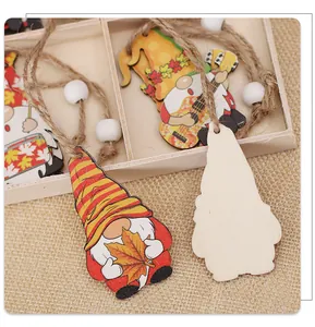 Close-up of wooden harvest gnomes with maple leaf patterns and rustic twine beads