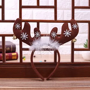 Christmas reindeer antler headband with white snowflakes and festive golden bells decoration