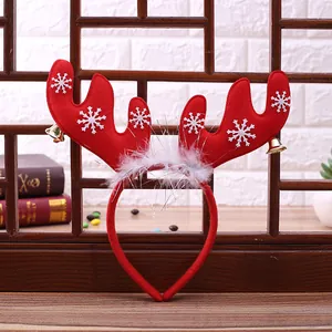 Christmas reindeer headband with red velvet antlers, white snowflakes and golden bells