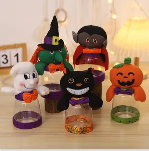 Detailed view of Halloween plush candy jars featuring ghost, witch, and vampire designs