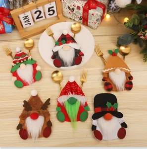 Set of 6 colorful Christmas gnome cutlery holders on a festive wooden table setting