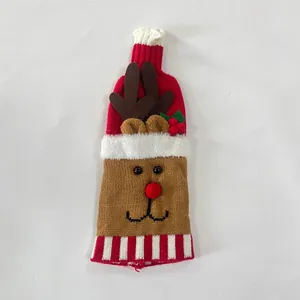 Detail of Christmas reindeer knitted wine bottle cover with 3D antlers and red pom-pom nose