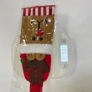 Detailed macro view of elk reindeer knitted Christmas wine cover weighing 43.1g on scale