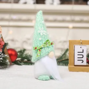 Christmas gnome doll with mint green knit hat and white beard for festive window display