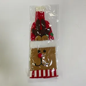 Close-up of knitted reindeer wine bottle cover in transparent retail packaging for Christmas