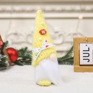 Handmade yellow knit Christmas gnome plush doll with long white beard and tree ribbon