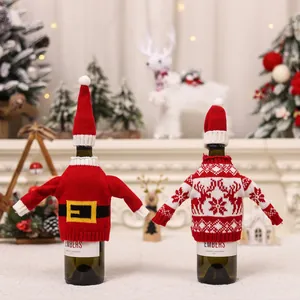Festive knitted Christmas wine bottle covers with Santa and reindeer patterns for table decor