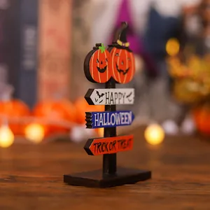 Halloween wooden tabletop decor featuring pumpkins and Happy Halloween sign boards