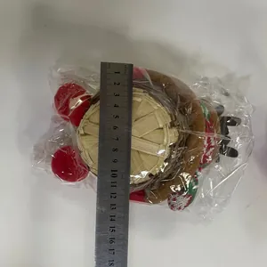 Detailed view of reindeer Christmas candy basket with plush decor and bamboo weave