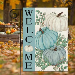 Detail of harvest garden flag with pumpkins and welcome text on a metal hanger