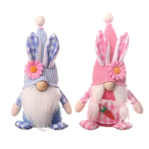 Easter gnome plush set with rabbit ears and carrots on a clean white background