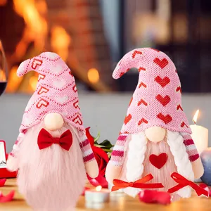 Romantic Valentine's Day couple gnomes plush set with pink heart hats on cozy home background