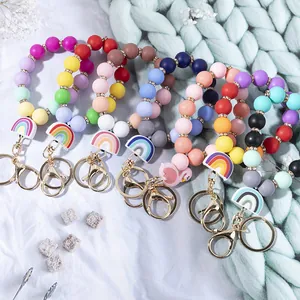 Colorful silicone bead bracelet keychain set with tassels and gold metal rings