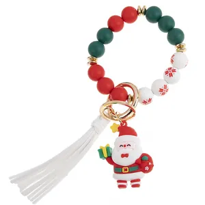 Weihnachts-Schlüsselanhänger aus Silikonperlen mit Nikolaus, weißer Quaste und Goldring
