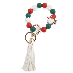 Christmas silicone bead keychain with gnome charm and white leather tassel detail