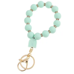 Macro detail of mint green silicone beads with rhinestone spacers and lobster clasp