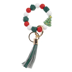 Silicone bead keychain wristlet with Christmas tree charm and fringe tassel detail