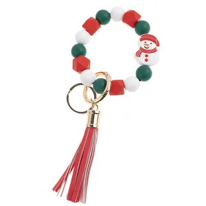 Christmas silicone beaded keychain with snowman pendant and red leather tassel detail