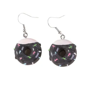 Creative chocolate donut earrings with white cream coating and colorful sprinkles