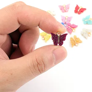 Ciondoli a farfalla in acrilico glitterato con bordo dorato per creazione gioielli fai da te
