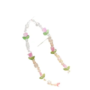 Pink tulip flower beaded phone charm with green leaf accents and clear crystals