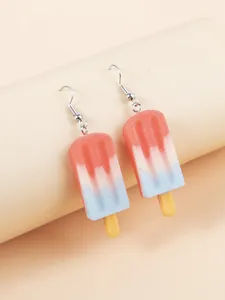 Detail of creative resin popsicle earrings with red white and blue gradient design