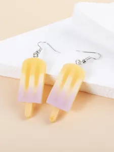 Macro detail of resin ice cream earrings with yellow and purple gradient on stone base