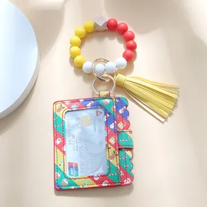 Christmas silicone bead bracelet with red reindeer card holder and yellow tassel keychain