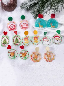 Detail view of festive Christmas acrylic earrings set with Santa, elk, and tree motifs