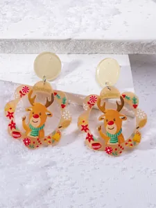 Close-up of acrylic Christmas earrings featuring reindeer motifs and snowflake patterns