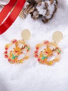 Detailed close-up of acrylic Christmas earrings featuring reindeer and festive patterns