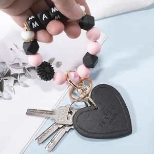 Silicone bead keychain with MAMA blocks, sunflower charm and LOVE leather heart pendant