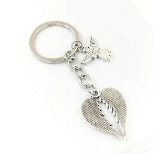 Guardian angel heart wings keychain with bird charm in vintage silver tone finish