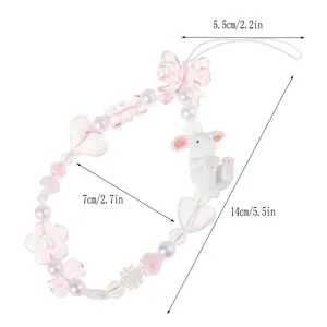 Chaîne de téléphone perlée avec nœud rose, lapin blanc et pendentif en cœur