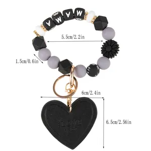 Detailed view of MAMA silicone beaded keychain with heart pendant and size measurements