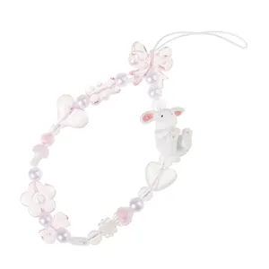 Bijou de téléphone rose pastel avec perles, lapin mignon et pendentif nœud papillon