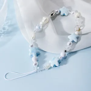 Blue and white beaded phone charm with resin star, faux pearls and silver fishbone bead