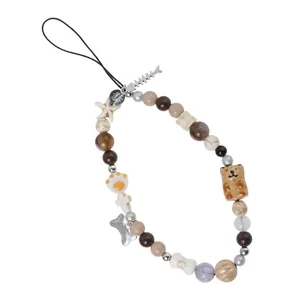 Beaded phone lanyard with bear, fishbone charms, and earthy tone marble beads