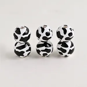 Farmhouse theme round wooden beads with black and white cow print for DIY jewelry making