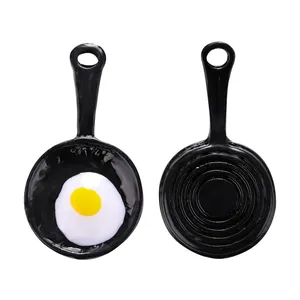 Miniature fried egg frying pan pendants with realistic resin texture and black handles